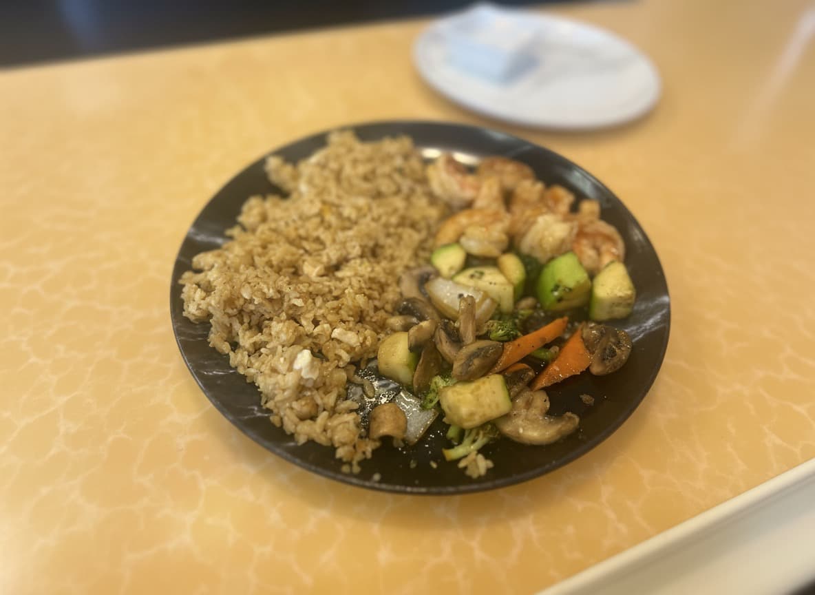 Hibachi shrimp plate with grilled vegetables and rice at White Buddha.